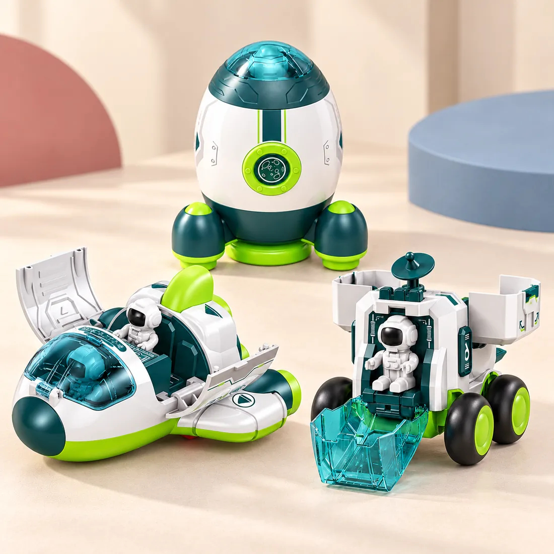 The rocket, spaceship and moon rover together in the green colourway, each open with an astronaut inside