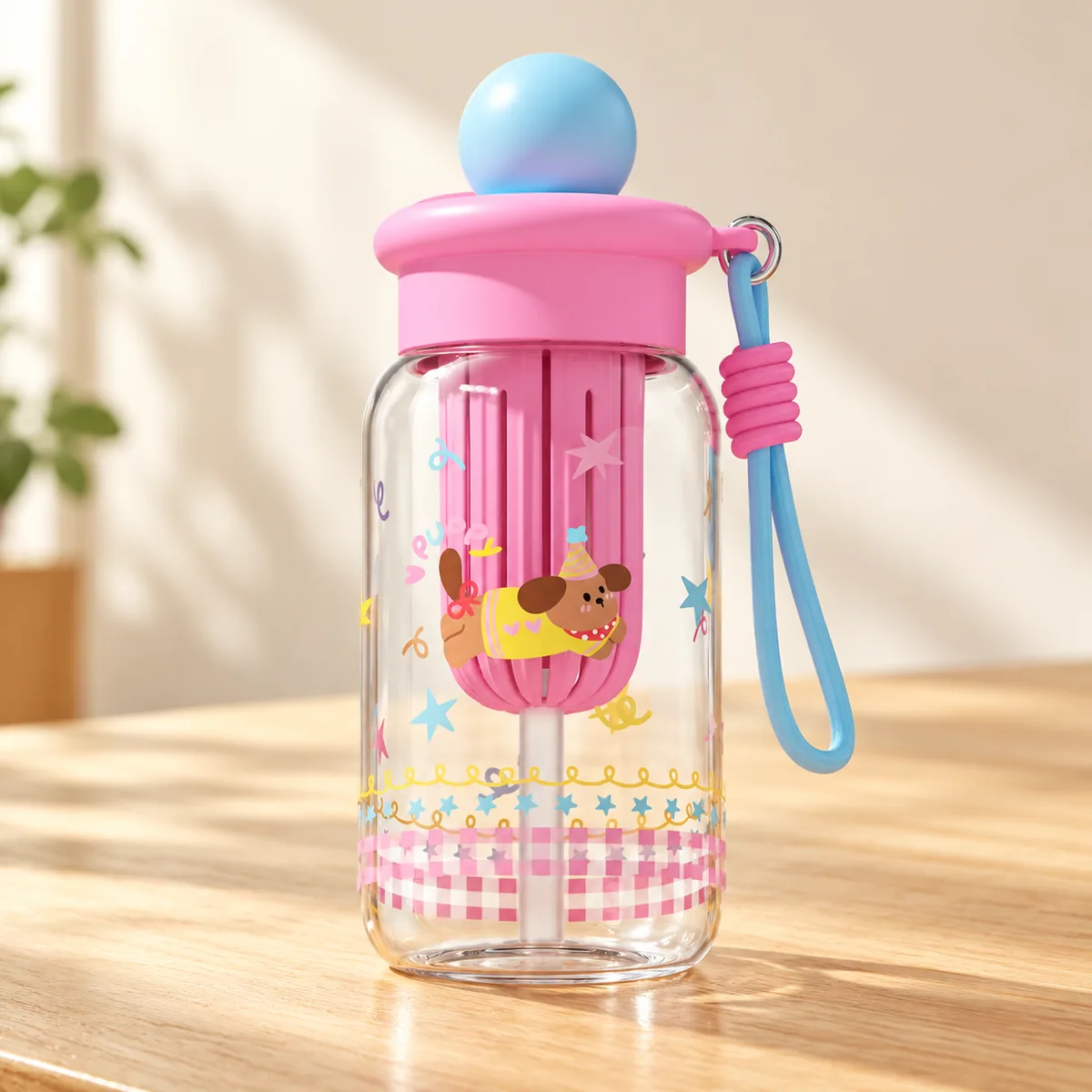 The Party Puppy design - pink lid, blue ball, a dog in a party hat on the straw sleeve