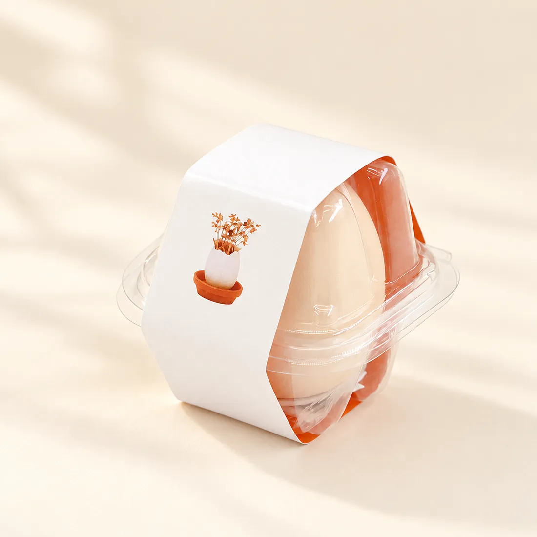 A single planter with an orange base