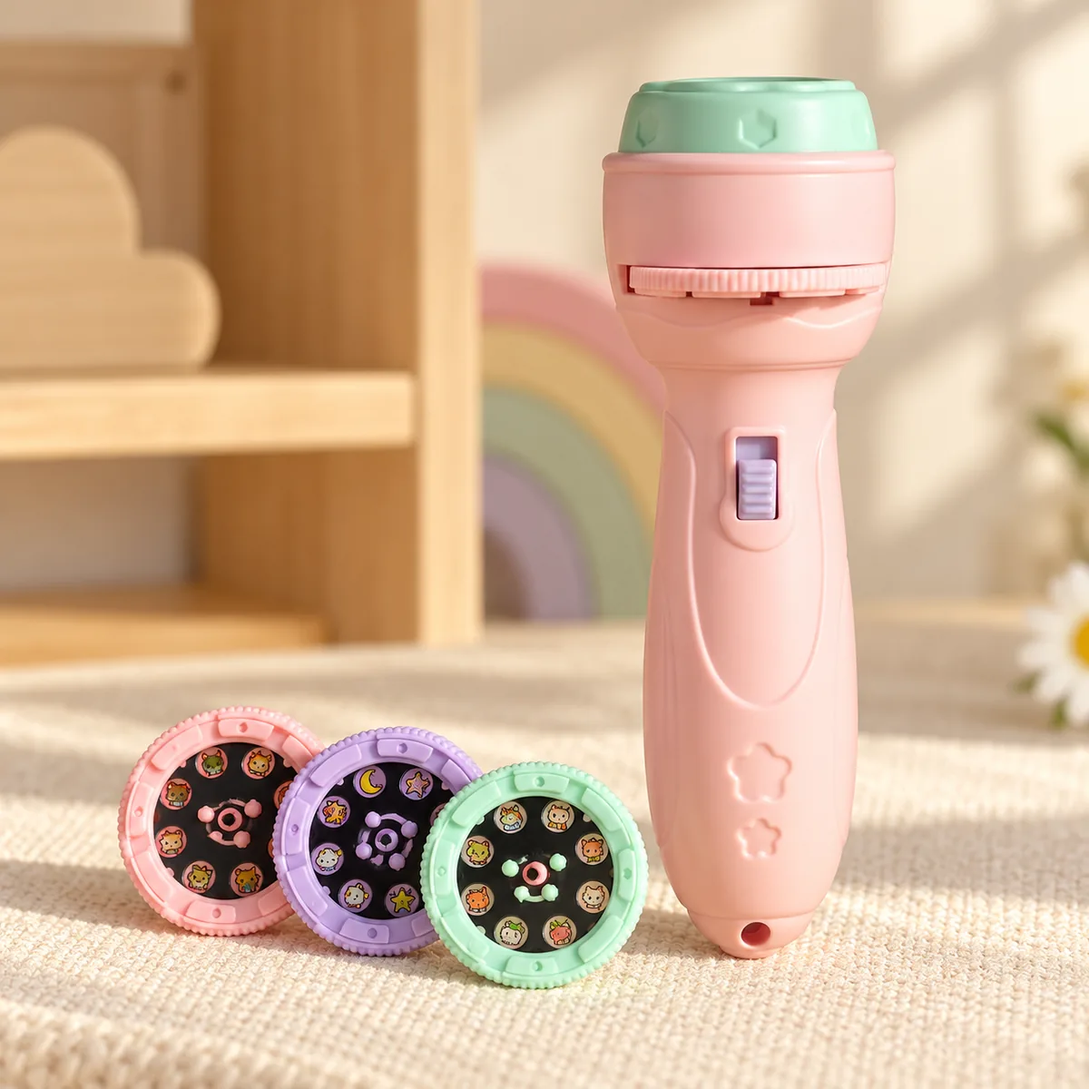 A pink torch standing upright with its three discs laid out in front