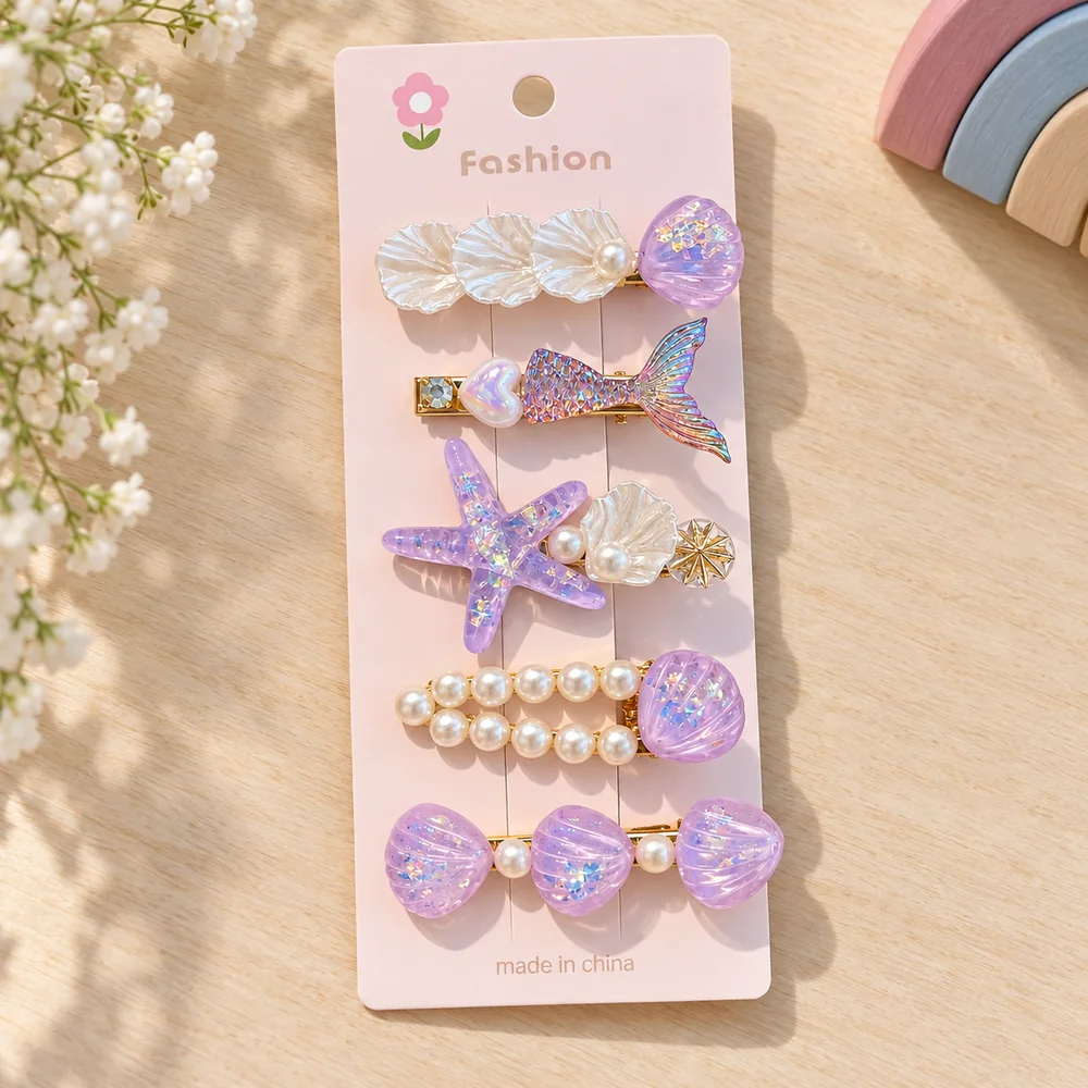 The purple card — the same five shapes in lilac with iridescent glitter through the resin