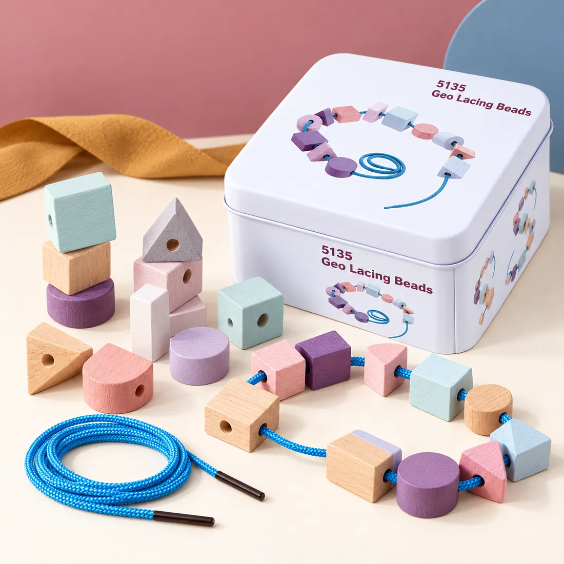 The Geo Lacing Beads tin with its wooden pieces laid out beside it